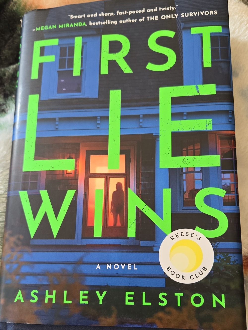 First Lie Wins by Ashley Elston - Bold Green & Blue Hardcover Novel